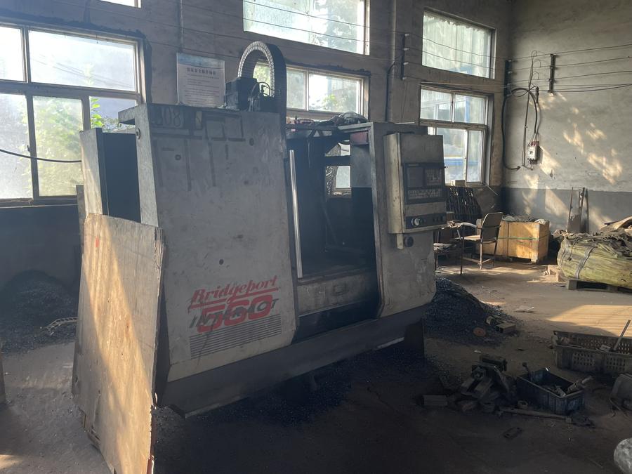 Older CNC machining equipment in a Chinese workshop